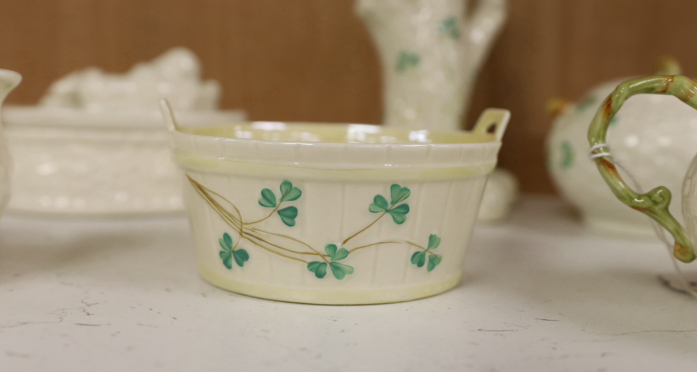 A quantity of Belleek ‘Clover’ pattern ceramics and a Belleek box and cover, tallest 18.5cm